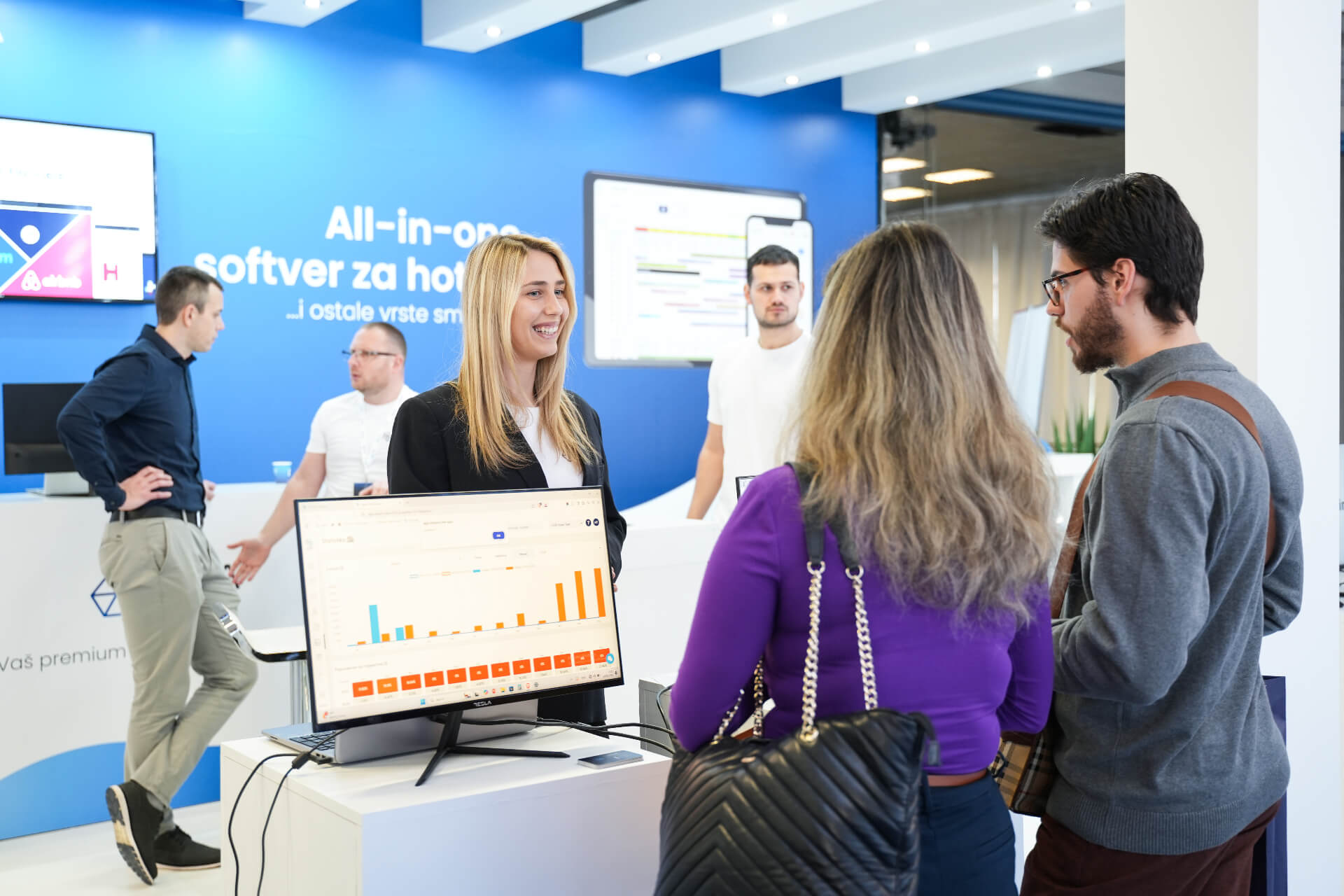 HotelSync team at a trade show presenting the platform